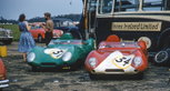 Innes Ireland and J. Westcott's Lotus XVs waiting in the paddock at the 1958 International Trophy Meeting in Silverstone. Innes Ireland and J. Westcott's Lotus XVs waiting in the paddock at the 1958 International Trophy Meeting in Silverstone.