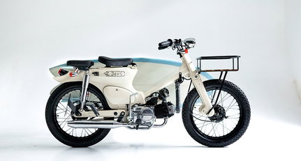 This Honda Super Cub is the coolest surfboard hauler around
