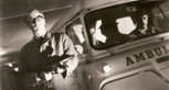 Caine and an ambulance in 'The Ipcress File' (1965).