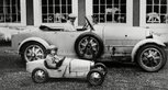 Jean and Roland, sons of French car manufacturer Ettore Bugatti in a car manufactured by their father. © Rexfeatures